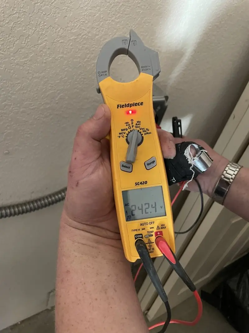 Voltage testing with clamp meter during Generator Installation in North St. Paul